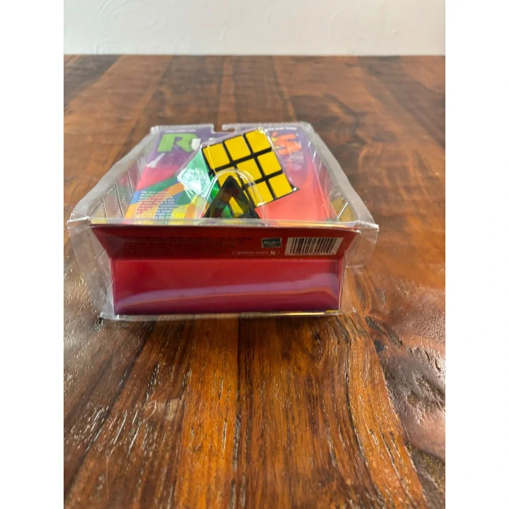 Milton Bradley Rubiks Cube 3x3 Puzzle with Stand and Booklet 54033 New Sealed